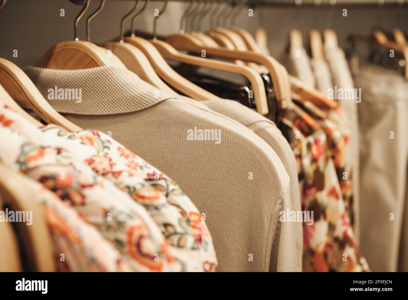 Colorful clothes on hangers in a modern boutique store Stock Photo Alamy