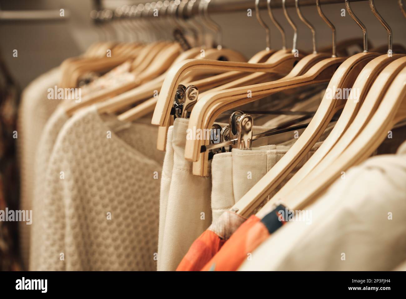 Colorful clothes on hangers in a modern boutique store Stock Photo Alamy