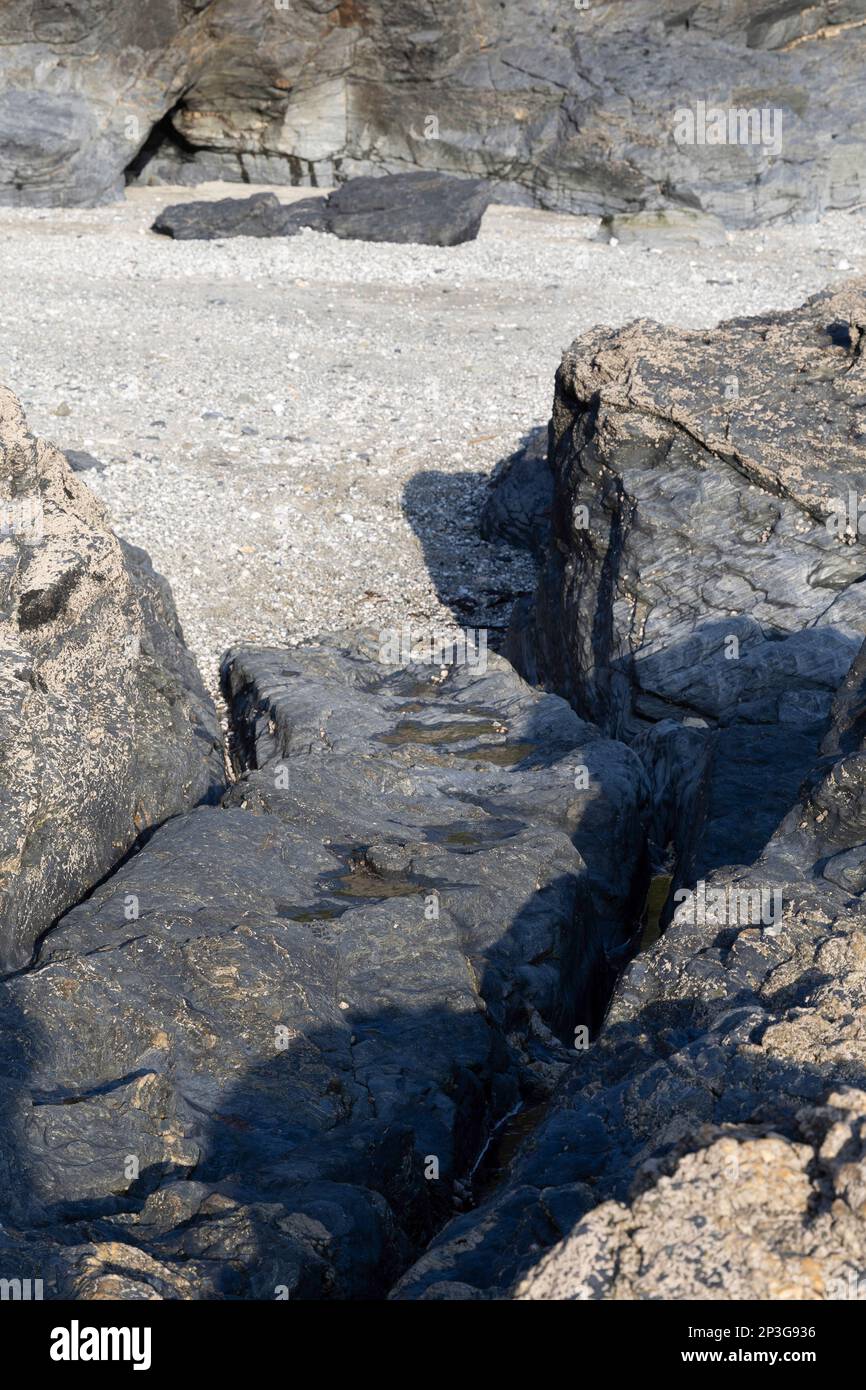 Cart wheel tracks worn in the rocks carrying contraband ashore at  Prussia Cove?  . Base of infamous 18th century smuggler John Carter Stock Photo
