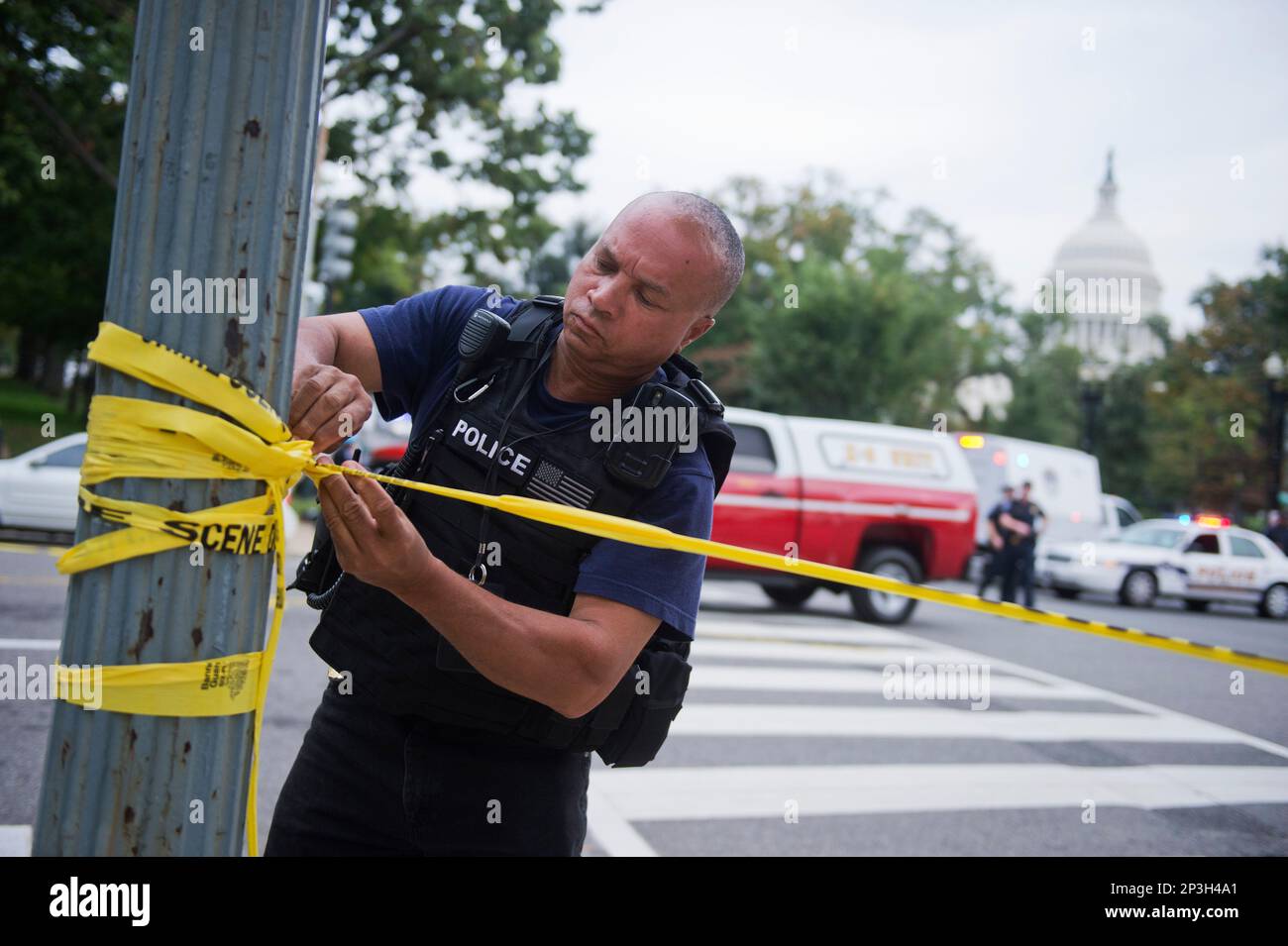 UNITED STATES - OCTOBER 03: A U.S. Capitol Police officer puts up ...