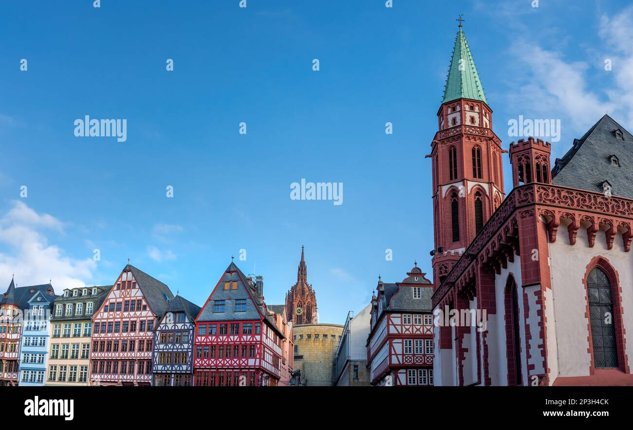 Old St. Nicholas Church and colorful Half-timbered buildings at Romerberg Square - Frankfurt, Germany Stock Photo