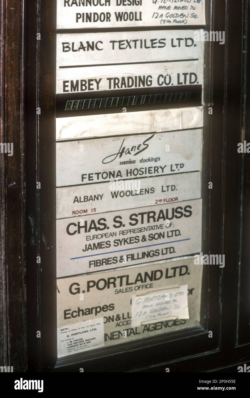 1976 archive photograph of signs for the offices of textile firms in Golden Square, Soho. Stock Photo