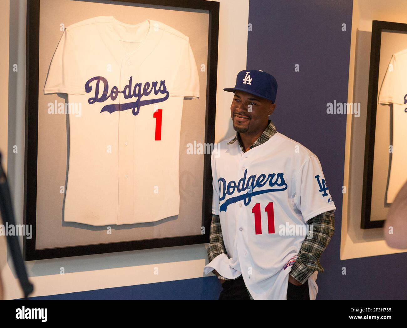 January 7, 2015 Los Angeles, CAJimmy Rollins takes a photo by the  retired jersey of ten time All Star and Hall of Fame member Pee Wee Reese  after his introductory press conference