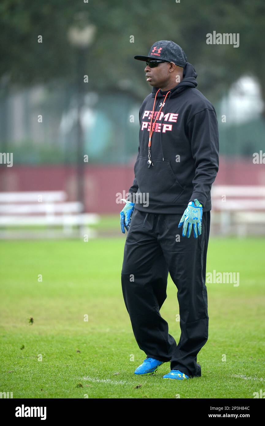 Former NFL defensive back Deion Sanders teaches a drill during the Under Armour Elite 50