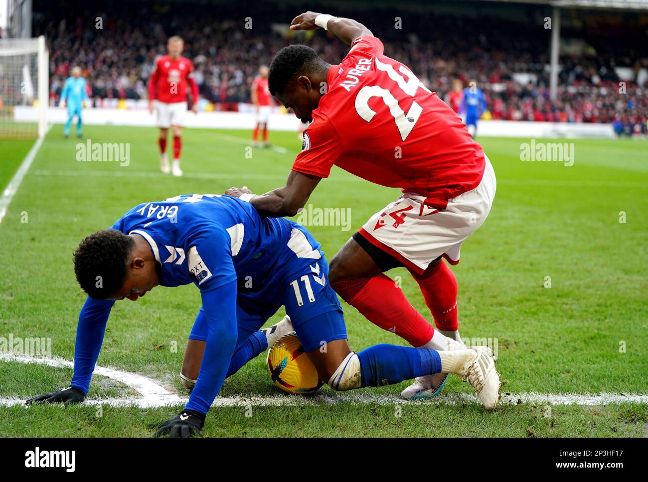 Everton's Demarai Gray (left) and Nottingham Forest's Serge Aurier battle for the ball during the Premier League match at the City Ground, Nottingham. Picture date: Sunday March 5, 2023. Stock Photo
