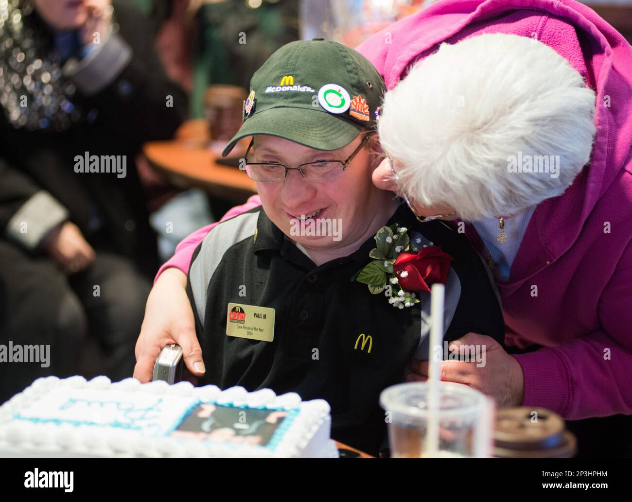 Pat Clark kisses her son, Paul Clark, who is the recipient of the Crew