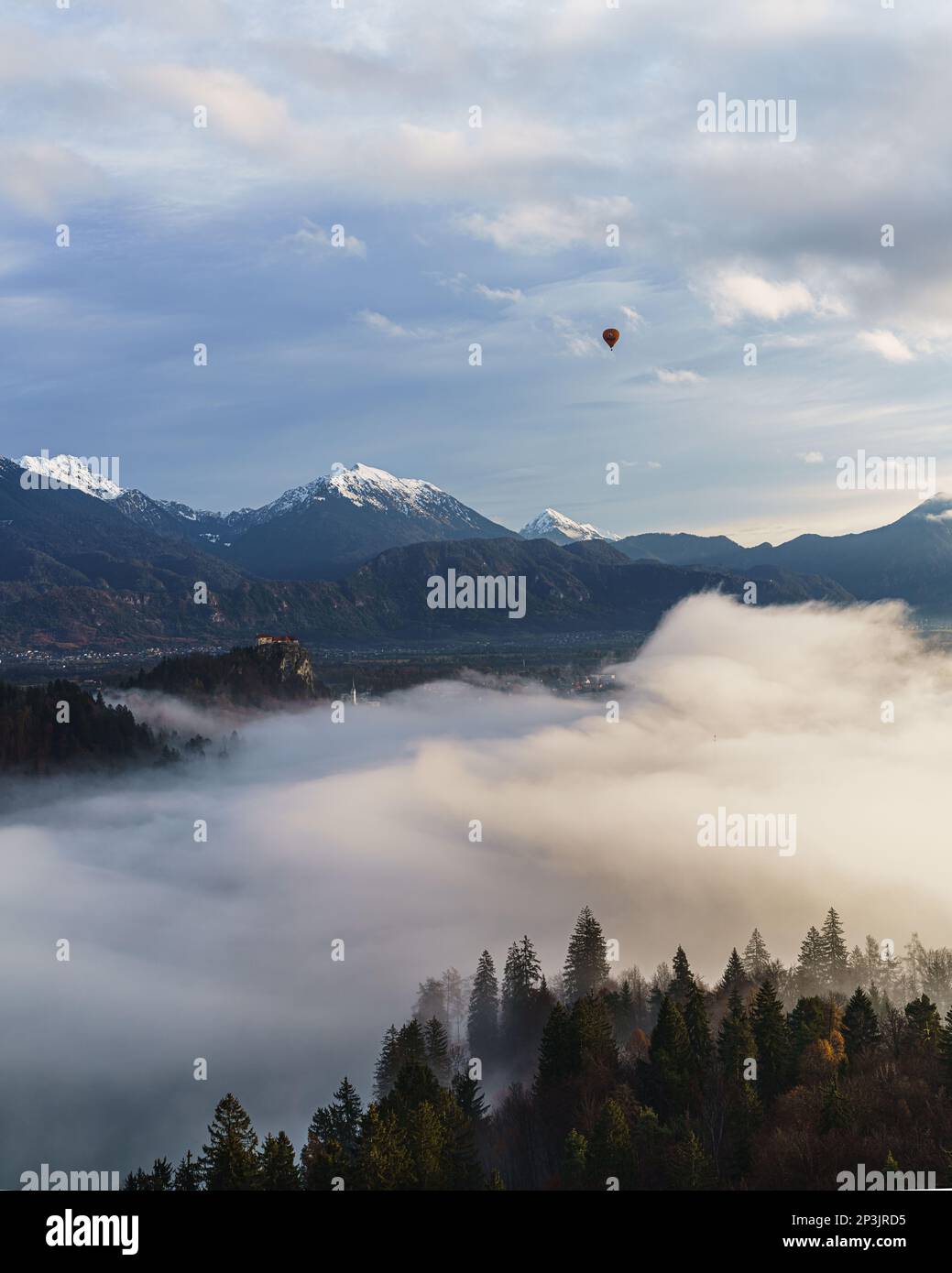 2022 12 30, Bled, Slovenia: Lake Bled, covered in Fog, with a Hot Air