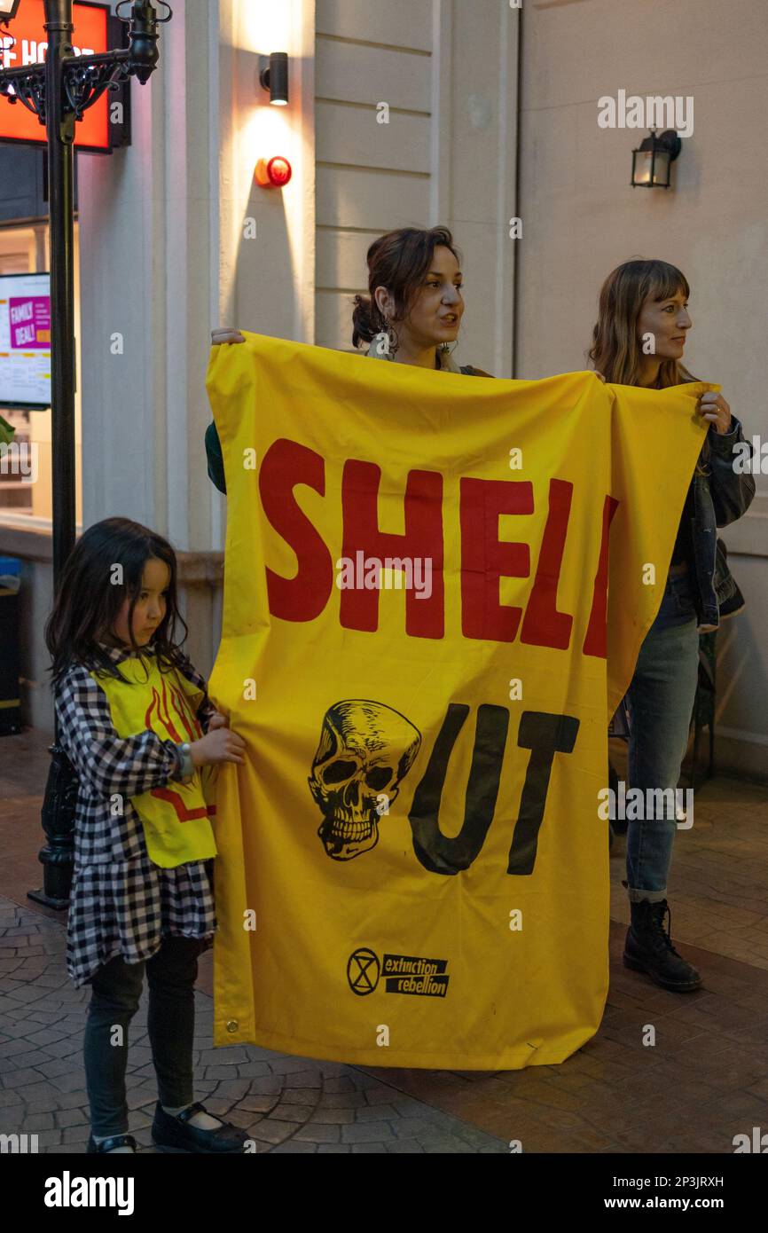 London, England, UK 05/03/2023 Children hold a protest against Shell and British Airways sponsorship at Kidzania indoor kids city, in the Westfield Shopping Centre. The called on the centre manager to stop their collaboration with fossil fuel companies like Shell and BA as they are both outdated job opportunities. The centre proceeded to call the police to attend the protest despite it involving children. Credit: Denise Laura Baker/Alamy Live News Stock Photo