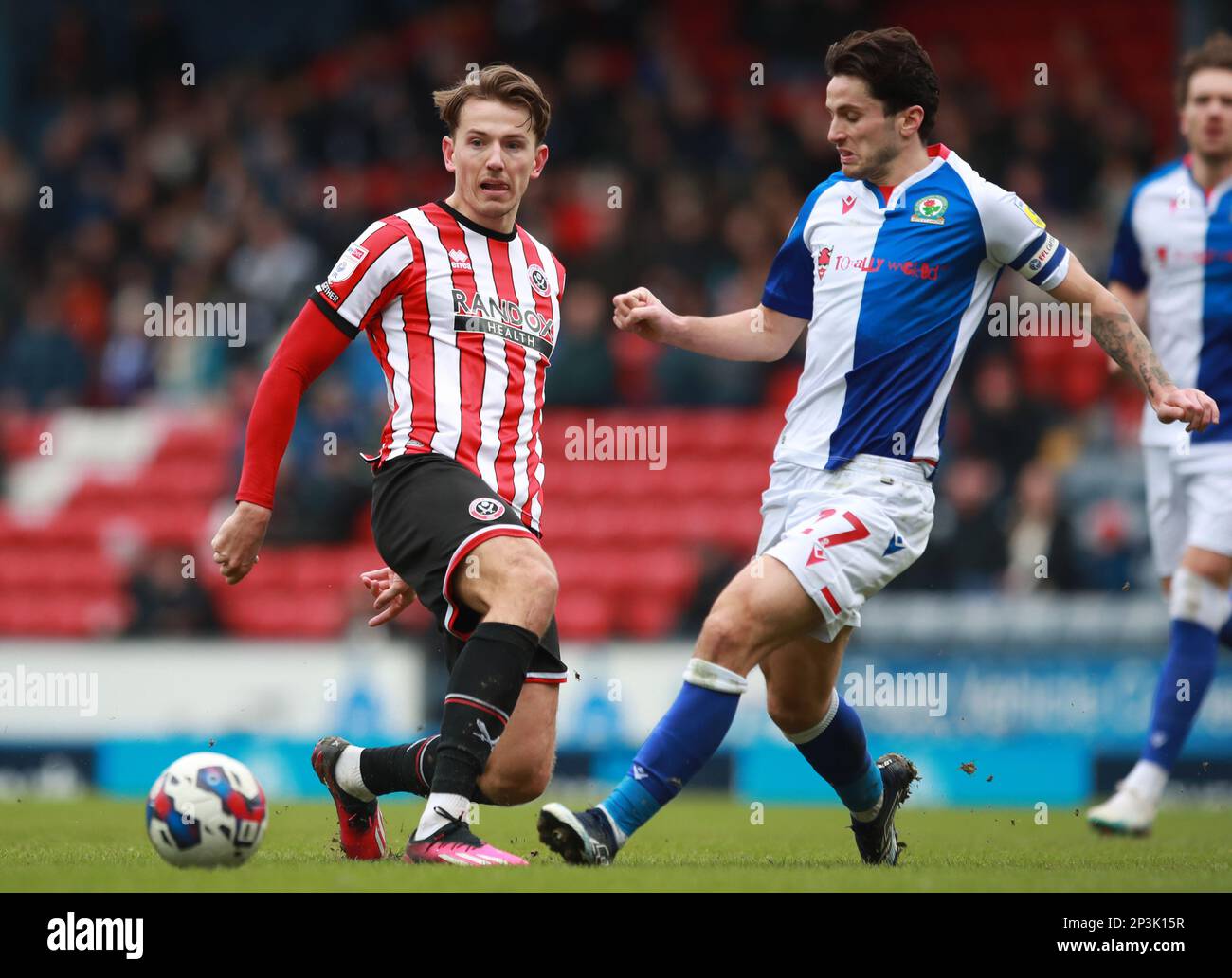 Blackburn, England, 4th March 2023. Sander Berge of Sheffield Utd challenged by Lewis Travis of Blackburn Rovers  during the Sky Bet Championship match at Ewood Park, Blackburn. Picture credit should read: Simon Bellis / Sportimage Stock Photo