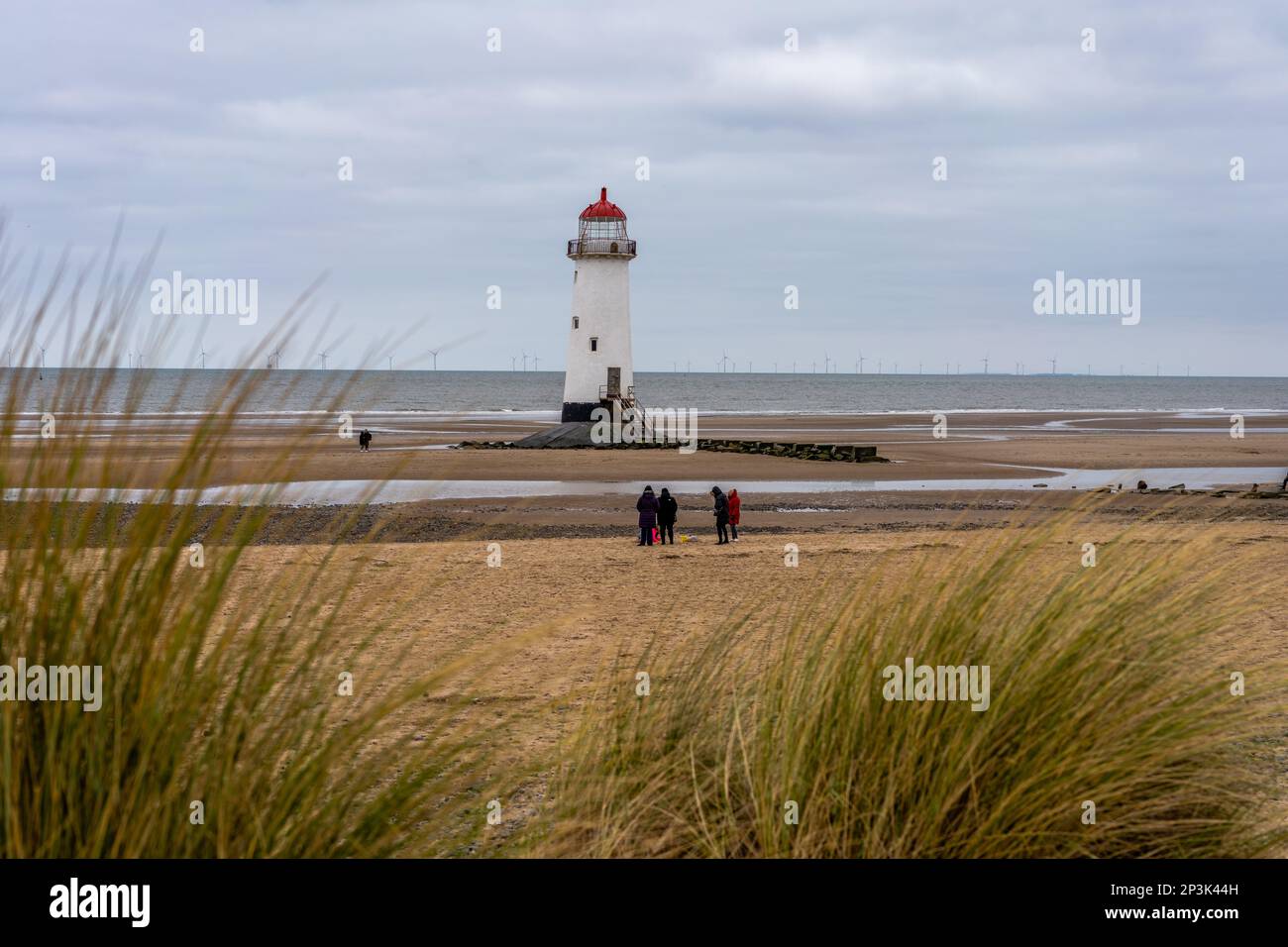 Talacre beach Point of Ayr light house peaking out above sand dunes and grasses. Stock Photo