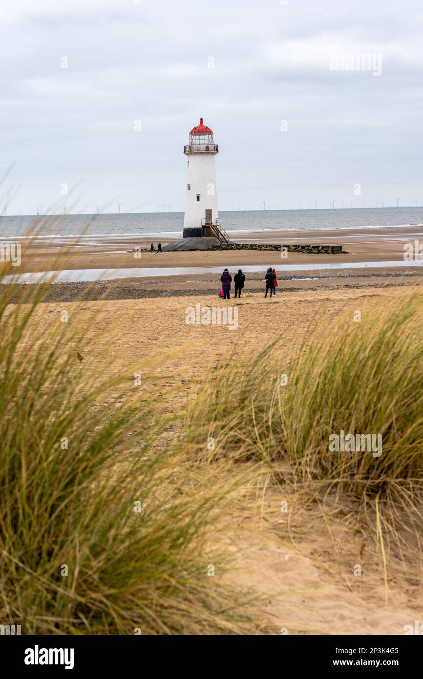 Talacre beach Point of Ayr light house peaking out above sand dunes and grasses. Stock Photo