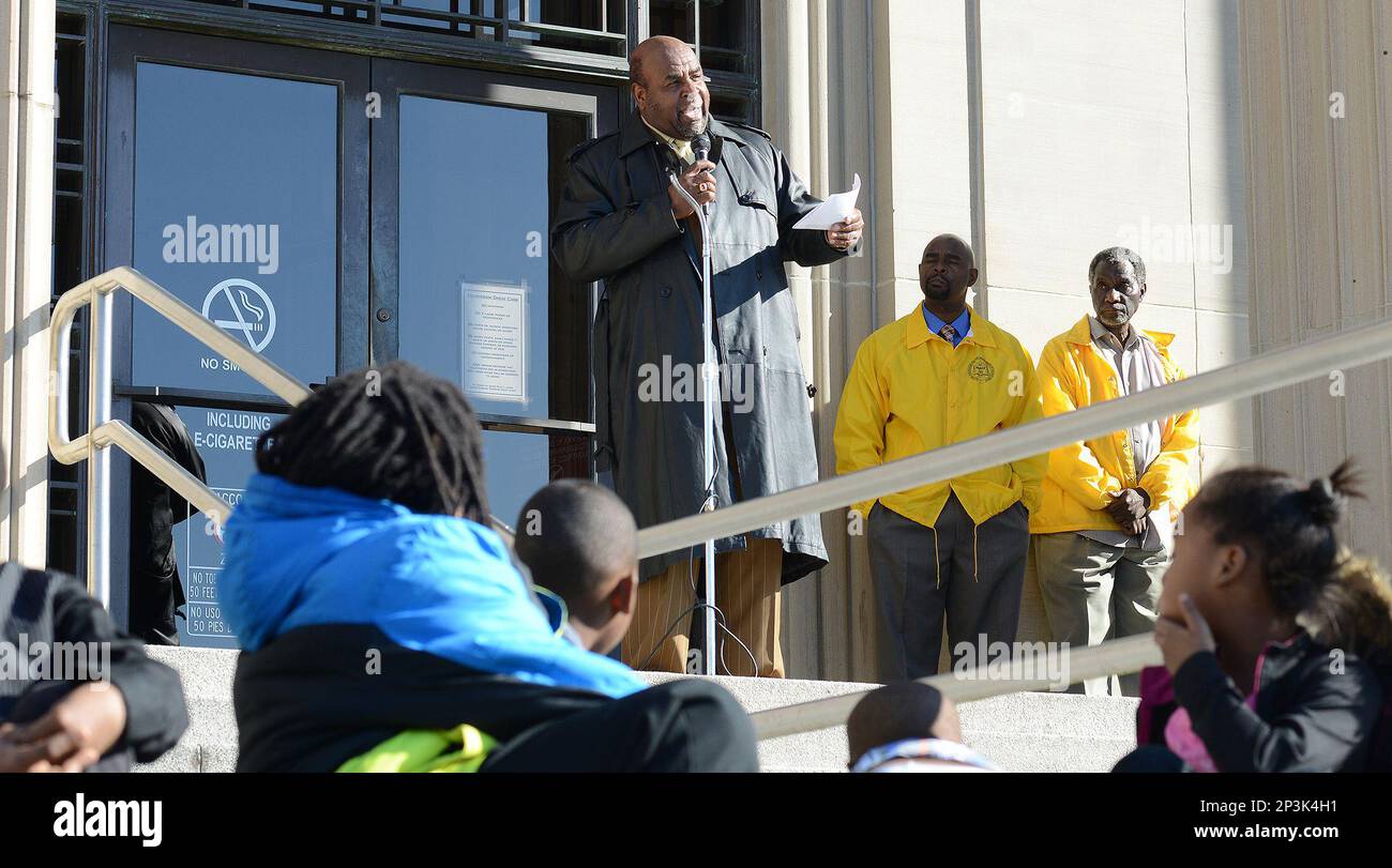 Rev. John Flowers addresses the crowd outside the Lenoir County