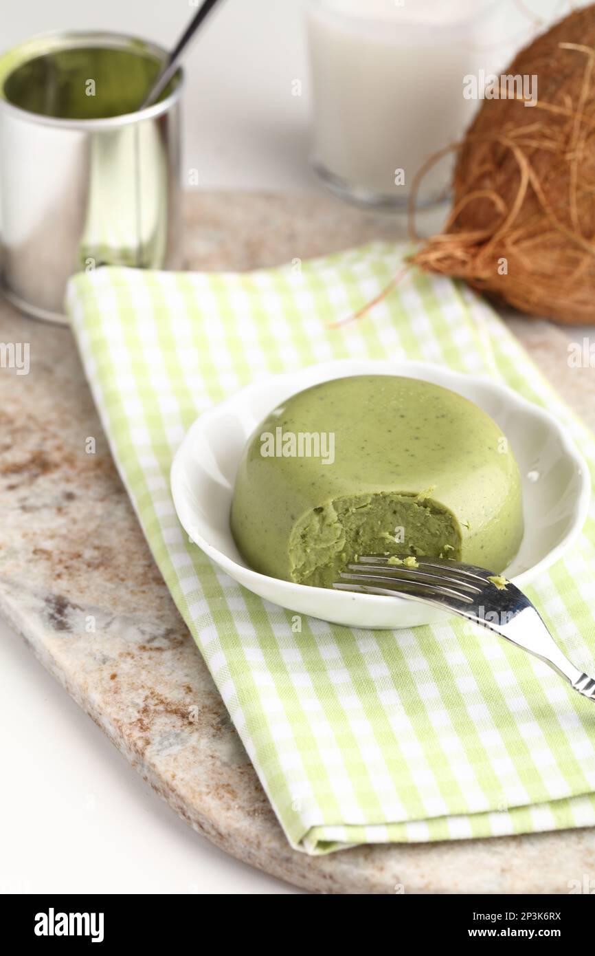 Matcha tea agar jelly served with a cup of cocos milk Stock Photo