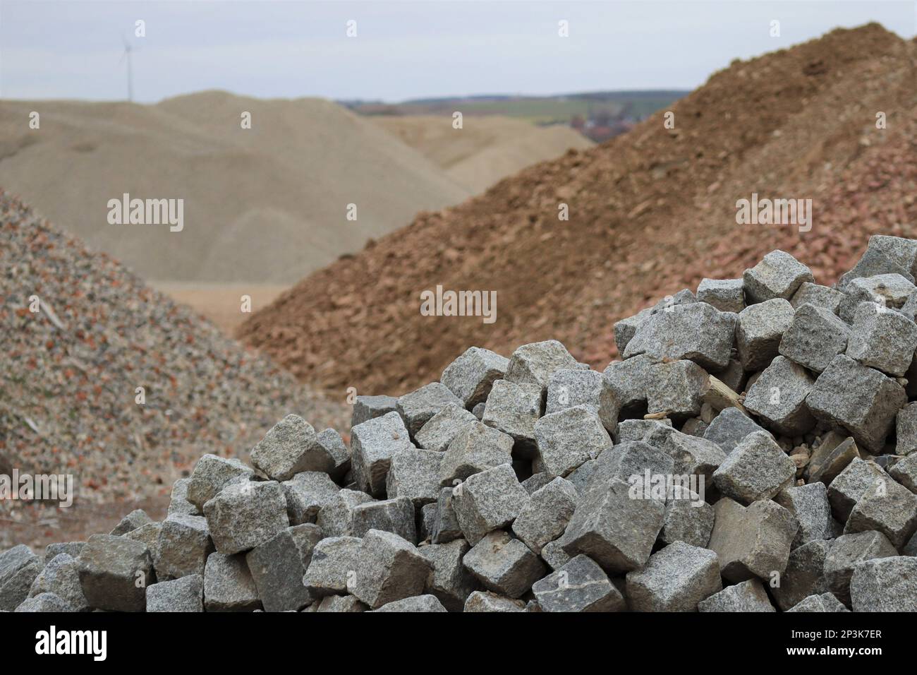 Cobblestones on a Landfill with all kinds of Rocks Stock Photo