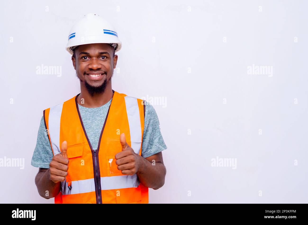 Handsome man with beard wearing safety helmet and reflective jacket