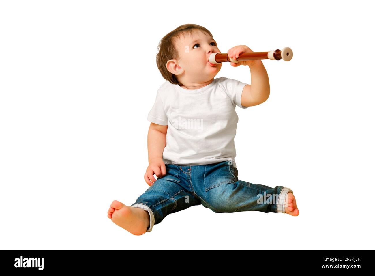 Toddler baby with a flute wind musical instrument on a studio isolated