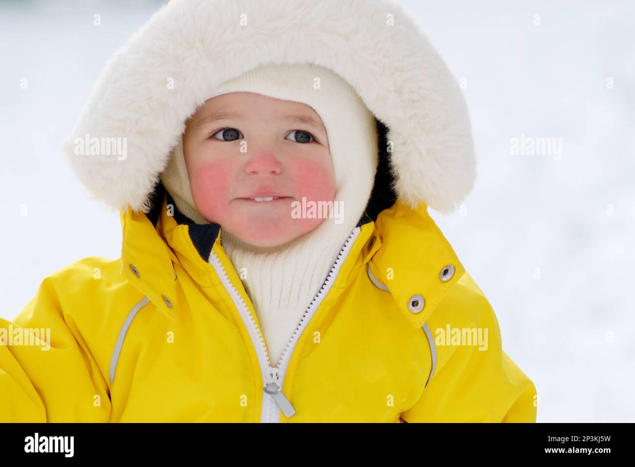 Young boy in warm winter thermal suit clothing outdoor portrait in snow  Model Release: Yes. Property Release: No Stock Photo - Alamy