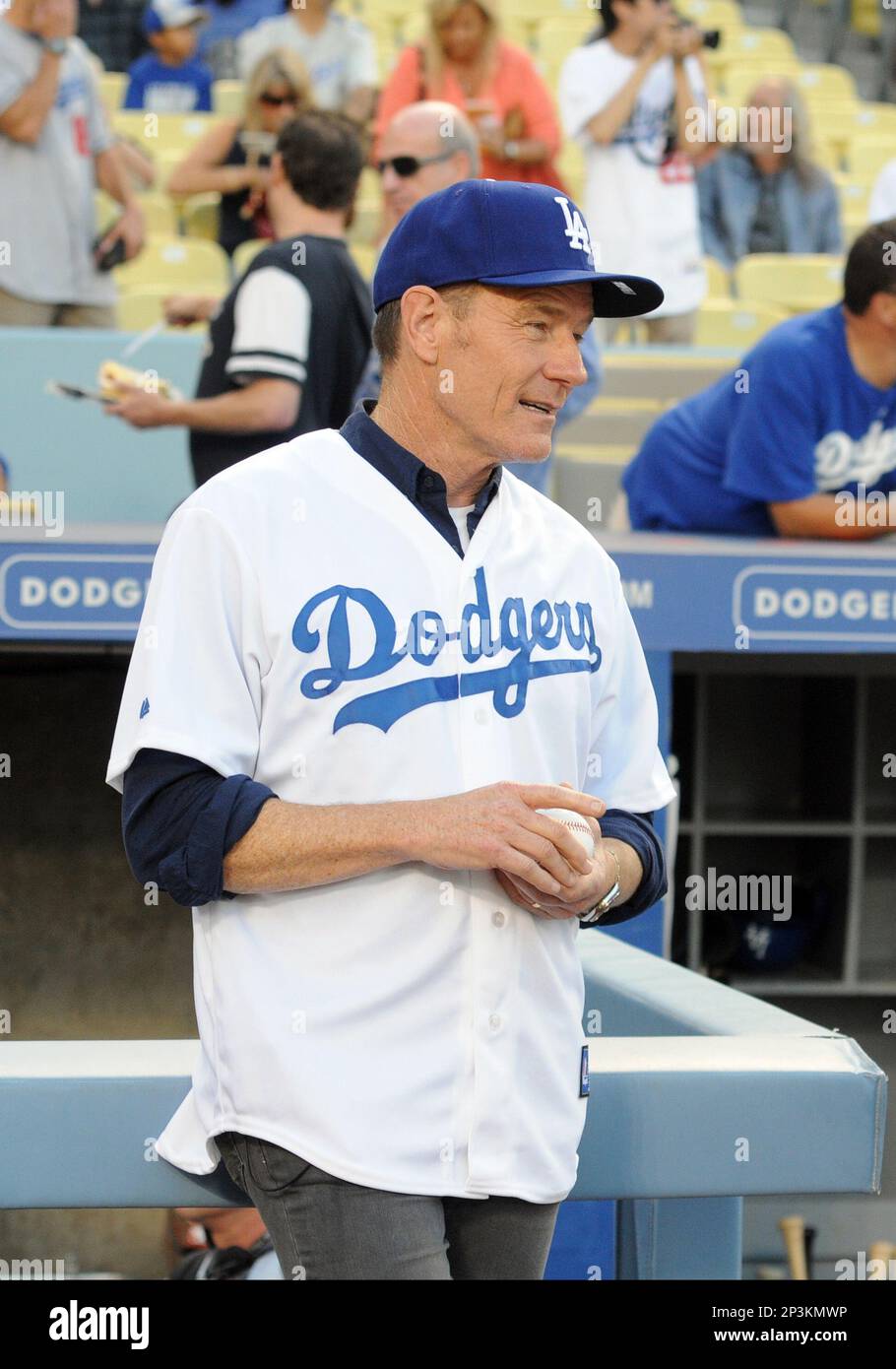 26 July 2013: Actor Bryan Cranston prior to throwing out the first pitch  during a Major League Baseball game between the Cincinnati Reds and the Los  Angeles Dodgers at Dodger Stadium in