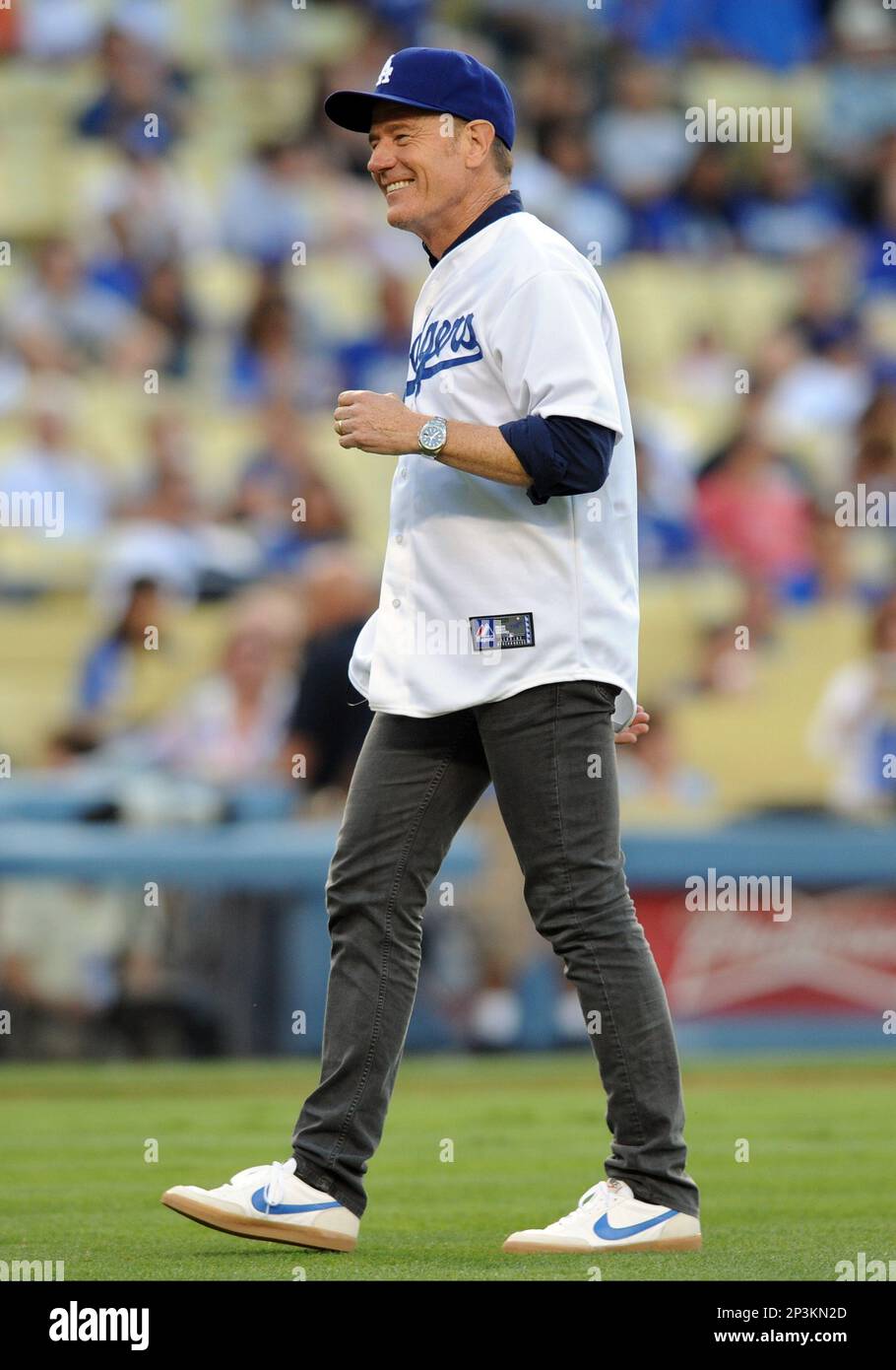 26 July 2013: Actor Bryan Cranston prior to throwing out the first pitch  during a Major League Baseball game between the Cincinnati Reds and the Los  Angeles Dodgers at Dodger Stadium in