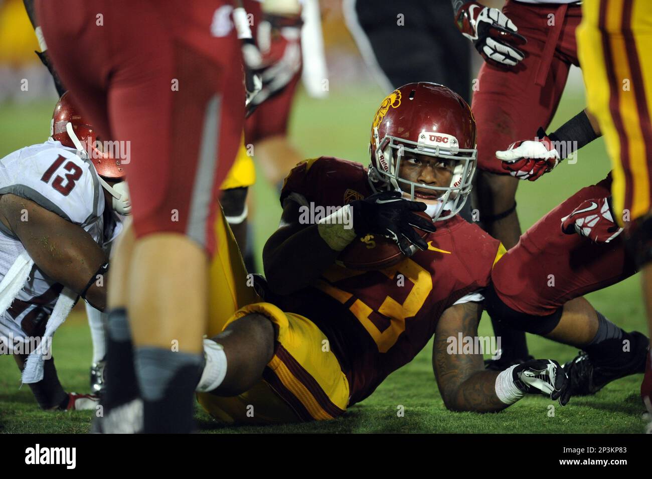 07 September 2013: USC (23) Tre Madden on the ground after being tackled  during an NCAA football game between the Washington State Cougars and the  USC Trojans at the Los Angeles Memorial