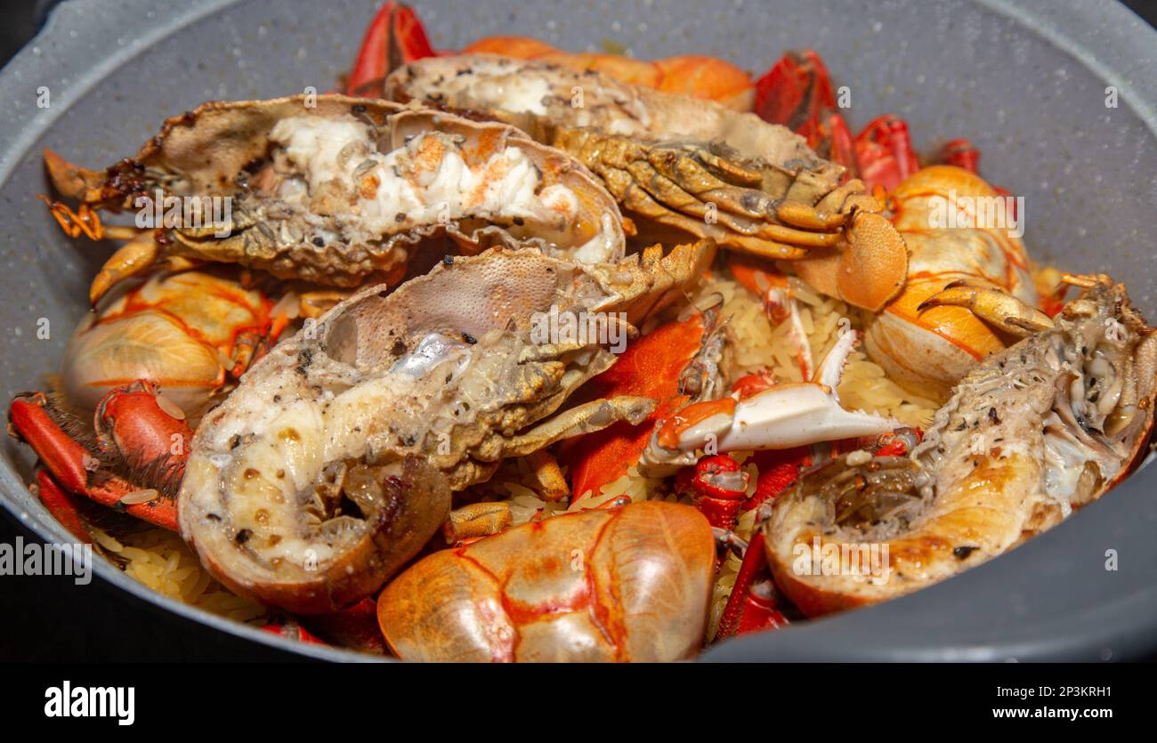 Assorted seafood to make paella, shrimp shells, squid, lobster, crab Stock Photo Alamy