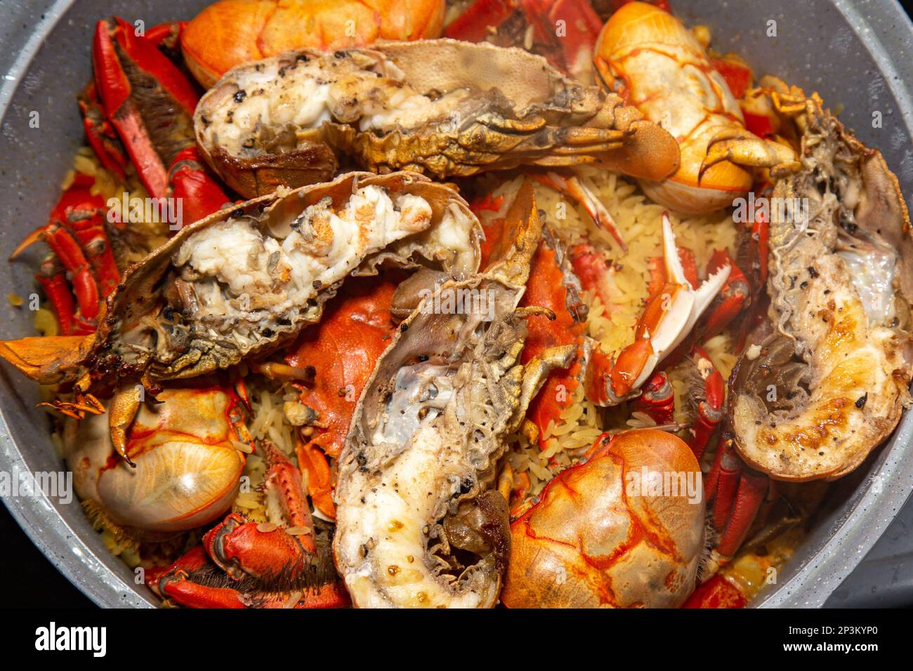 Assorted seafood to make paella, shrimp shells, squid, lobster, crab Stock Photo Alamy