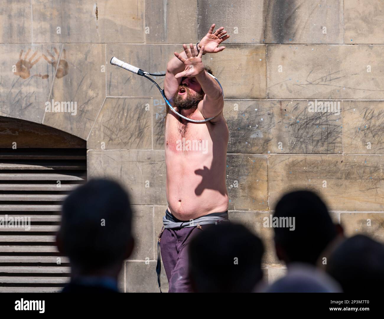 Street entertainer contortionist performing during festival with a ...
