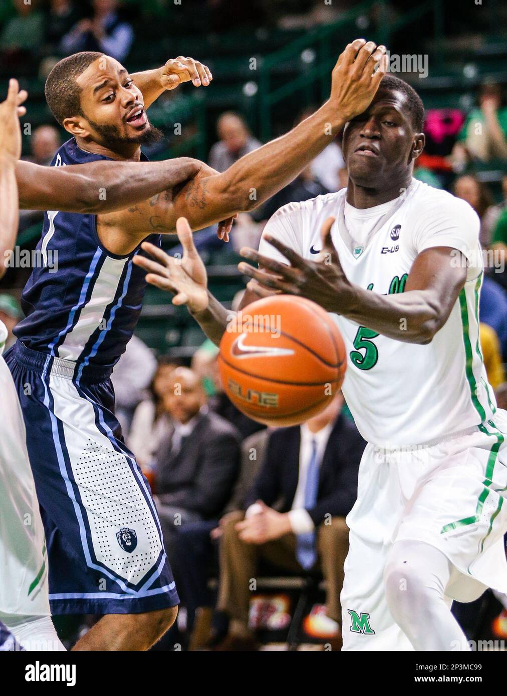 Marshall's Cheikh Sane (5) and Old Dominion's Aaron Bacote (1) fight for a  loose ball during an NCAA college basketball game Thursday, Jan. 8, 2015,  at the Cam Henderson Center in Huntington,