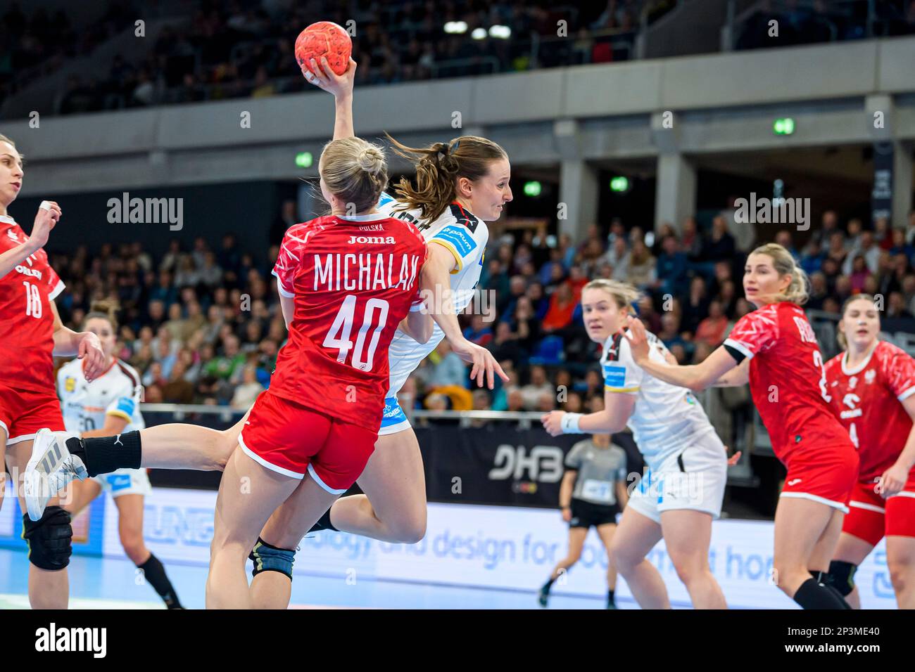 Heidelberg, Germany. 05th Mar, 2023. Handball, women: International match, Germany - Poland. Daria Michalak (M left) from Poland and Julia Maidhof (M right) from Germany fight for the ball. Credit: Marco Wolf/dpa/Alamy Live News Stock Photo