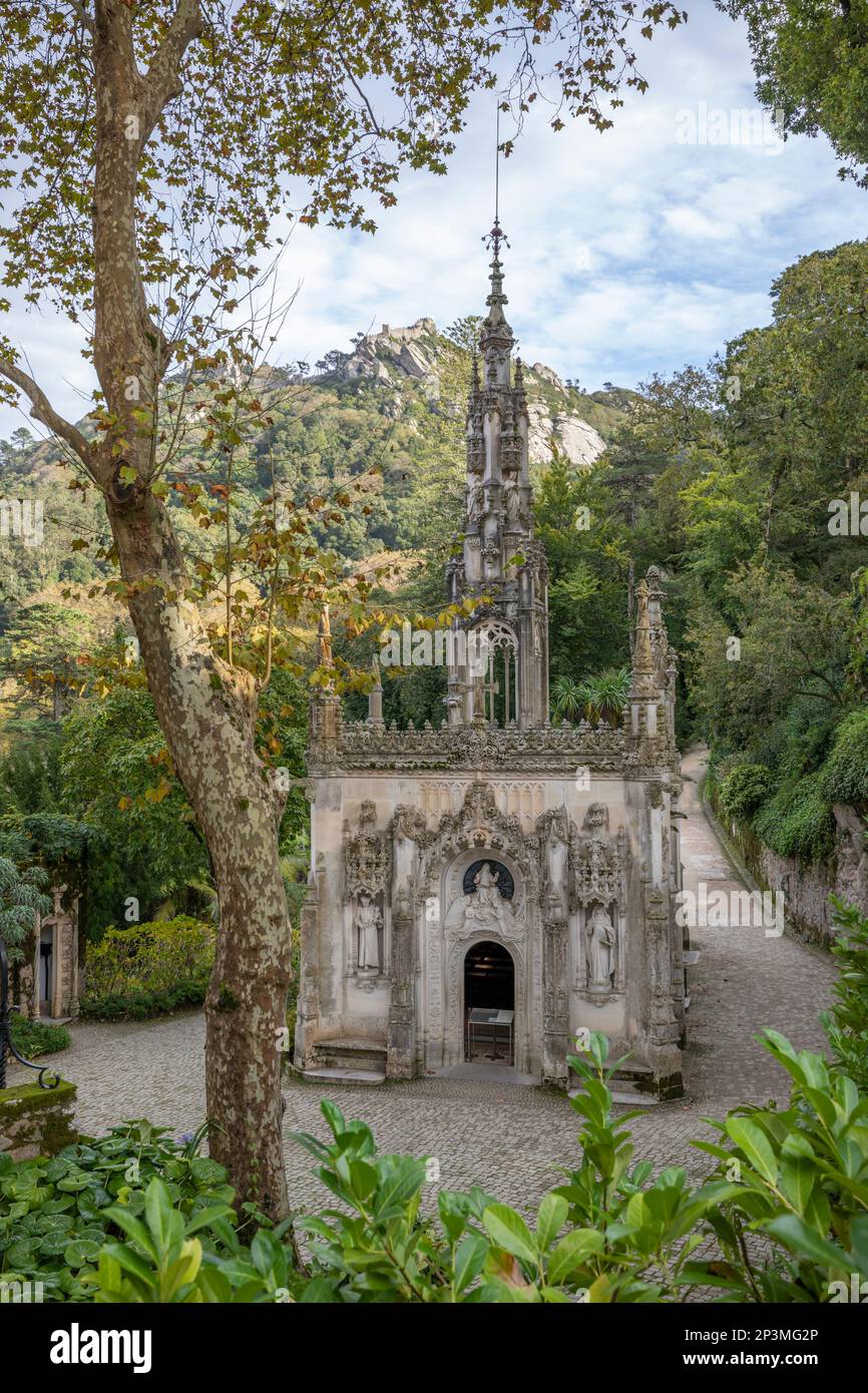 The Capela in the Quinta da Regaleira with the Moorish castle on hill behind, Sintra, Lisbon Region, Portugal, Europe Stock Photo