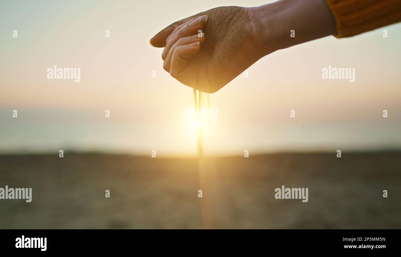Sand slips through your fingers. Time is fleeting Stock Photo Alamy