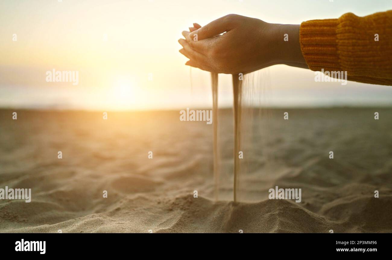 Sand slips through your fingers. Time is fleeting Stock Photo Alamy