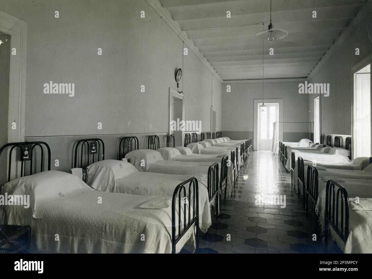 Female school dormitory, beds, Italy Stock Photo