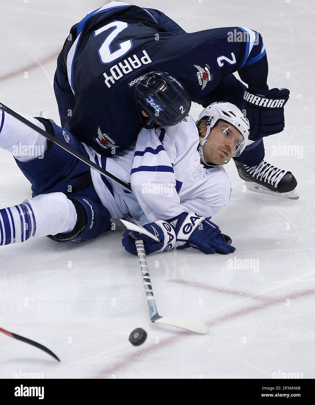 Winnipeg Jets' Adam Pardy (2) takes down Toronto Maple Leafs' David