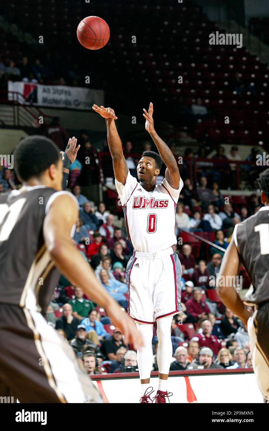 Massachusetts' Donte Clark shoots in the first half of an NCAA college