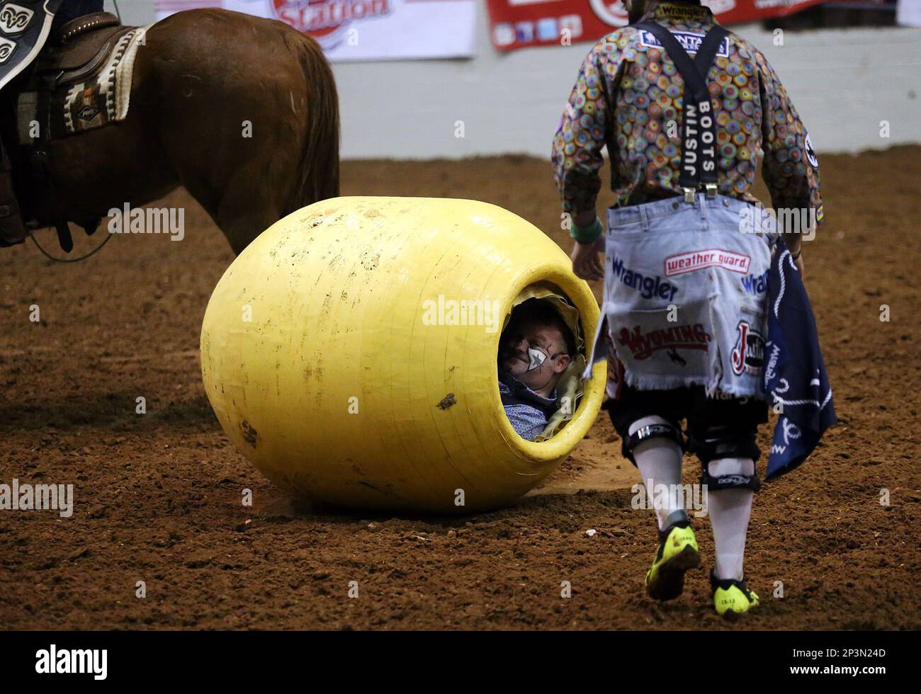 Barrel man Justin Rumford peeks out of the barrel after it was knocked