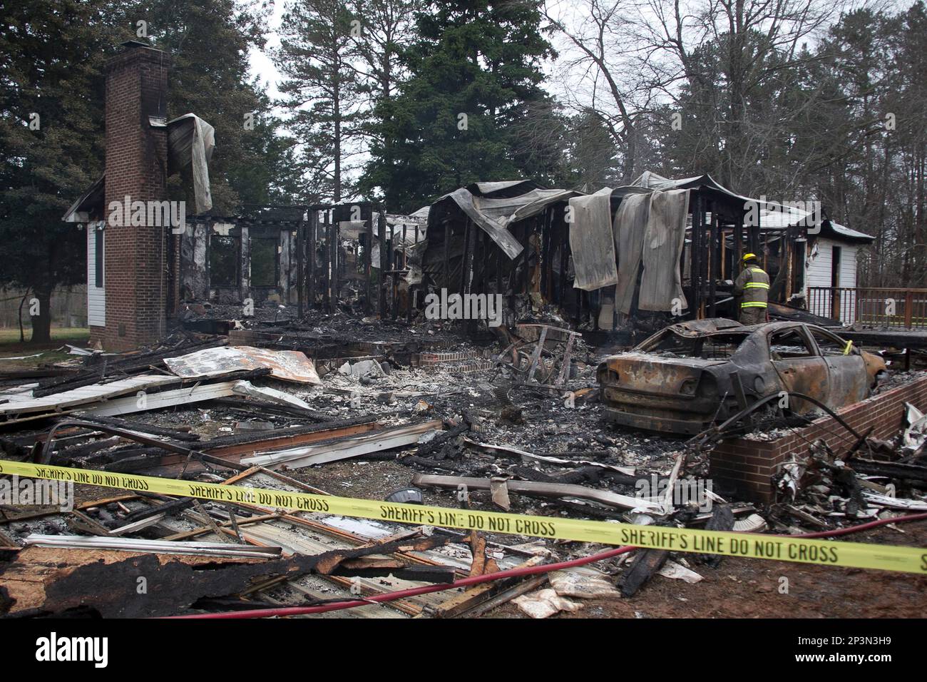 A Cornwall Volunteer fireman arrives to extinguish the smoldering