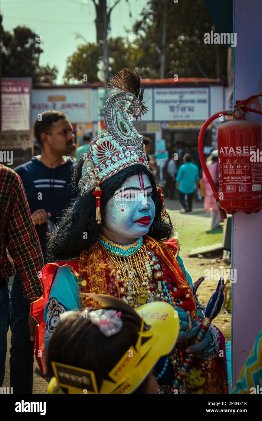 Kolkata, India - February 12, 2023: A young man cosplaying as Lord 'Krishna' at Kolkata Book Fair. Selective Focus. Stock Photo