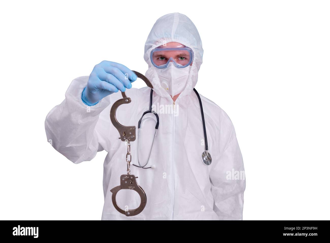 A doctor in a white uniform wearing a medical face mask with handcuffs in his hands, isolated on a white background Stock Photo
