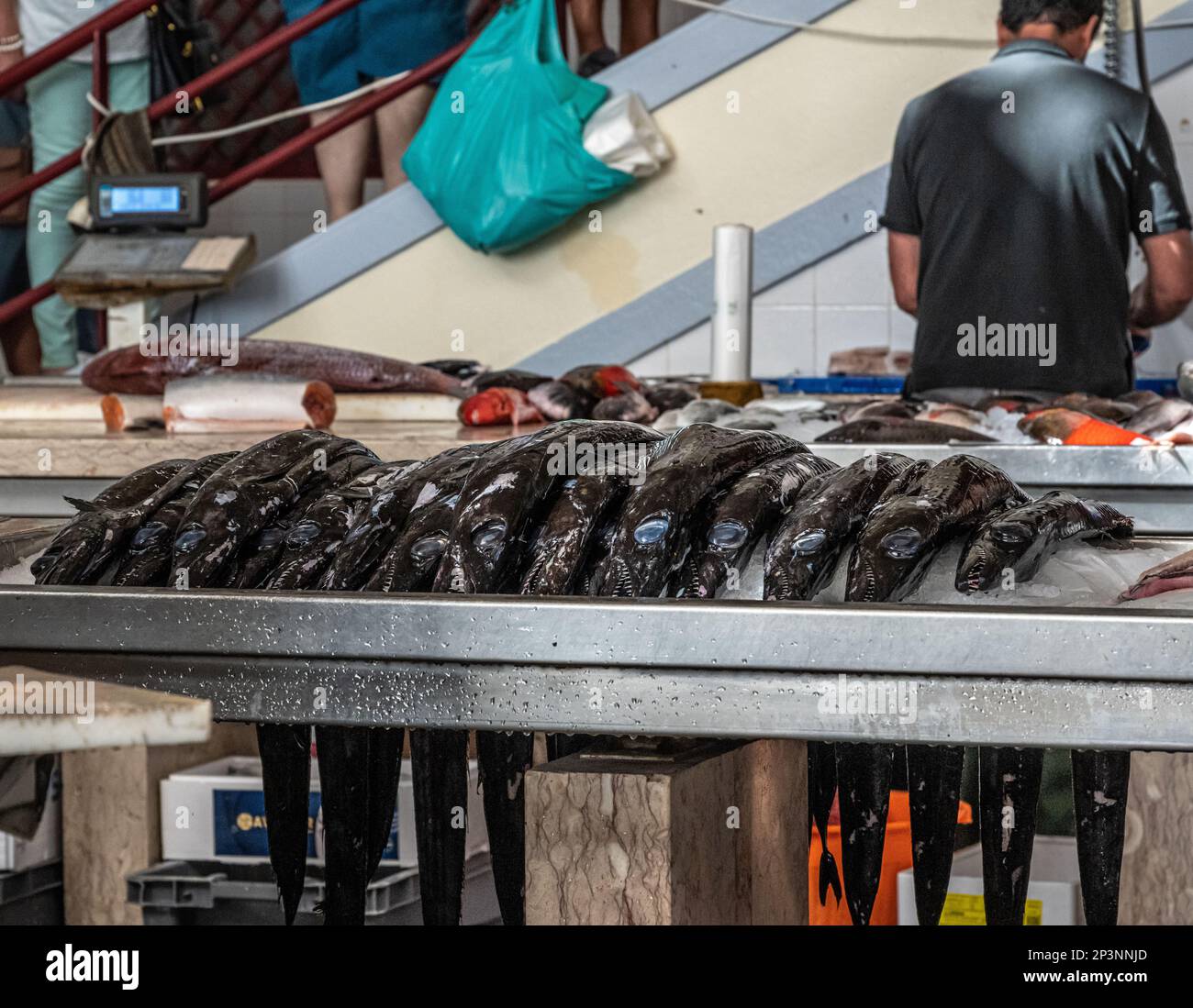 Local fish being prepared in the fish market, Funchal, Madeira Stock Photo