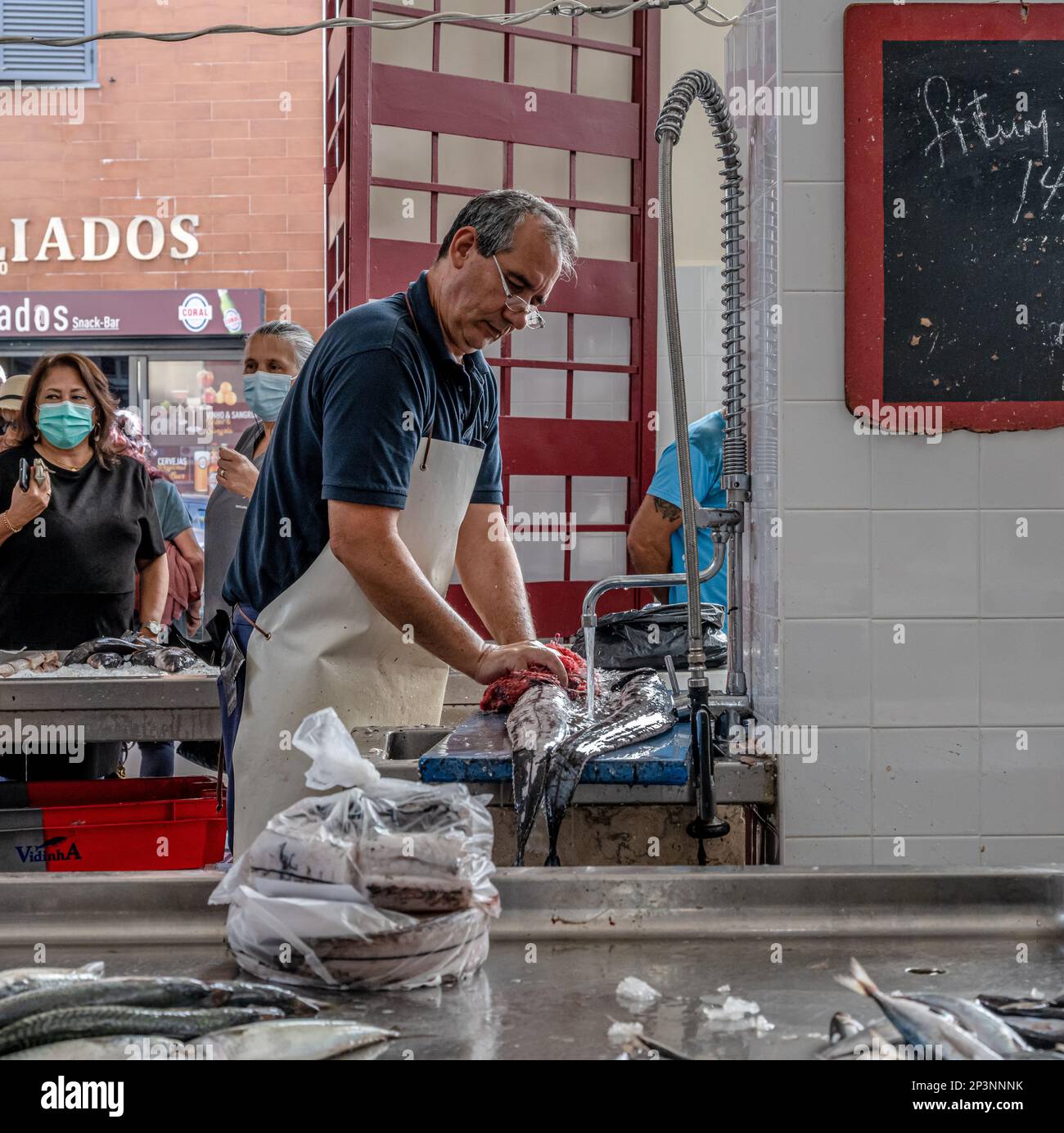 Local fish being prepared in the fish market, Funchal, Madeira Stock Photo