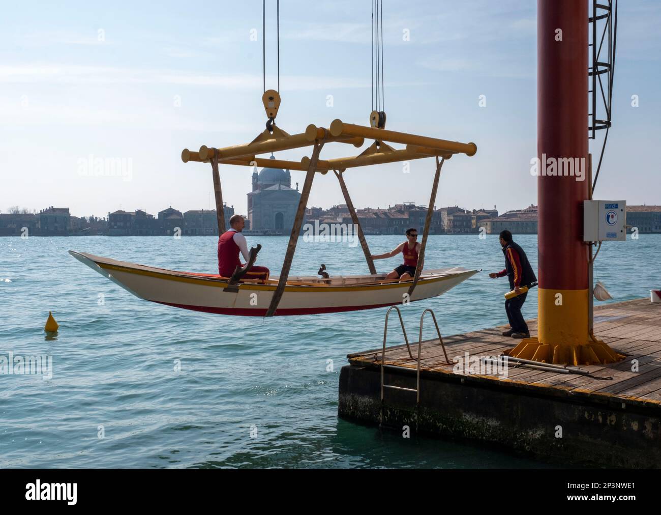Gondola being lifted from the Canale della Guidecca, Venice, Italy Stock Photo
