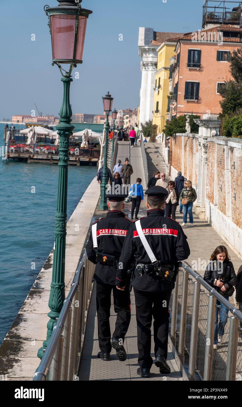 Carabinieri on patrol the embankment of the Fondamenta Zattere Al Gesuiti, Venice, Italy. Stock Photo