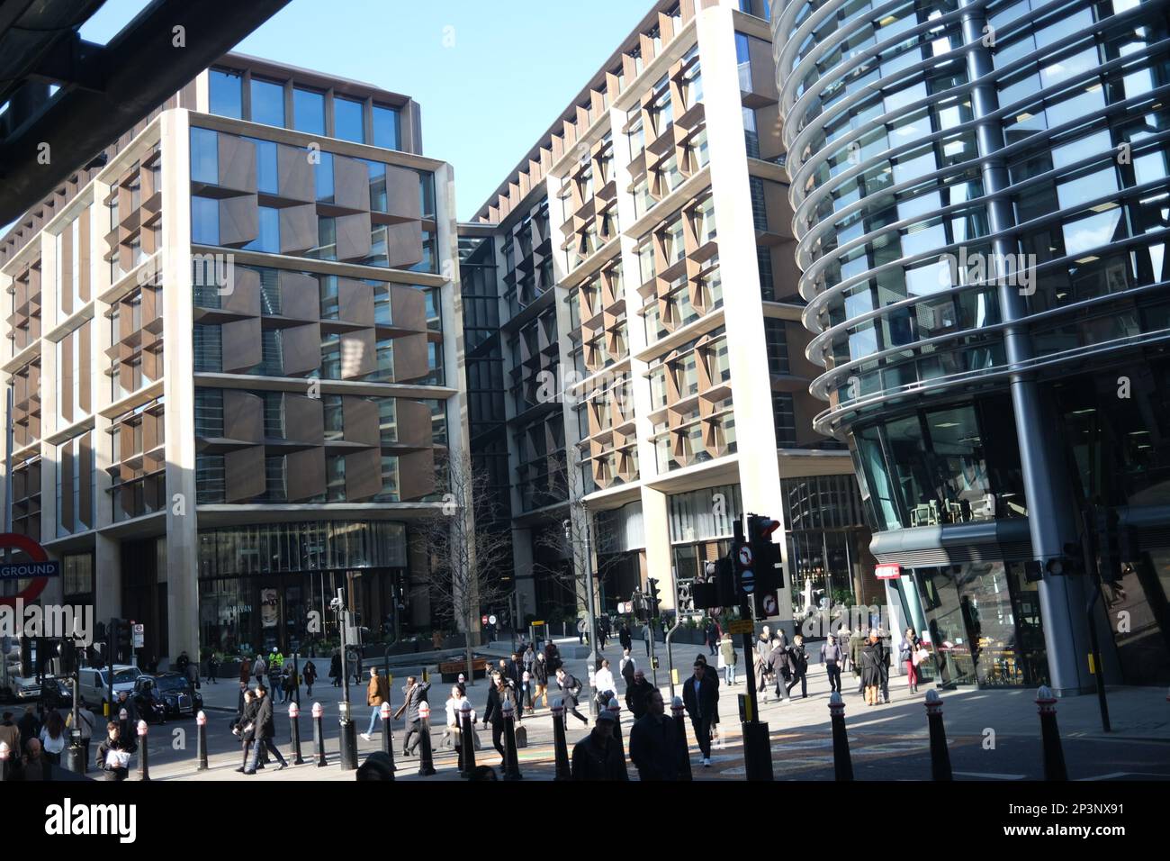 A busy lunchtime scene in Cannon St, City of London, with lots of people of various professions and vocations going about their business. March 2023 Stock Photo
