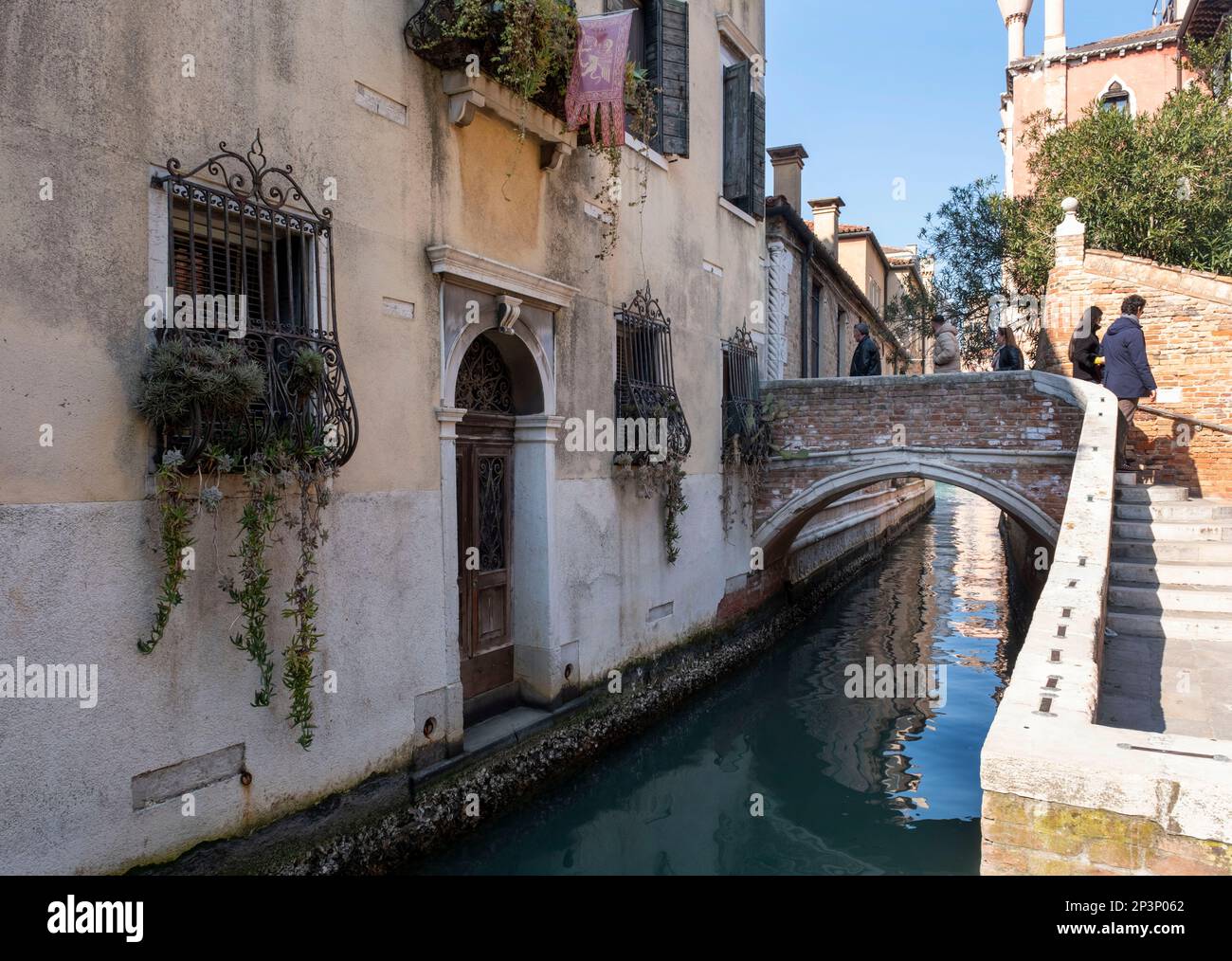 Scenic back street and canal near the Salute area, Venice, Italy Stock Photo