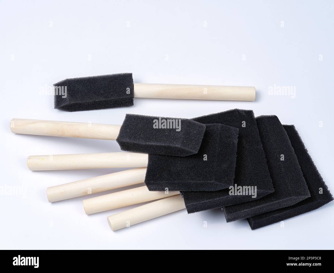 Black paint brushes with wood handles of different sizes Stock Photo ...