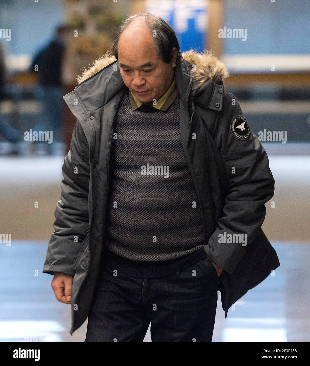 Diran Lin, father of Jun Lin, walks at the Montreal Courthouse on the  eighth day of jury deliberations in the murder trial for Luka Magnotta  Tuesday, Dec. 23, 2014. A jury found