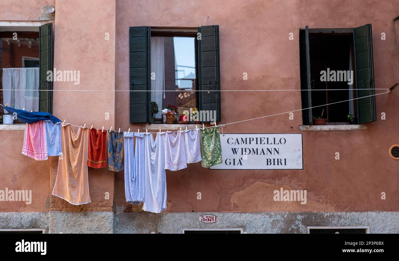 Washing hanging outside a house in Campiello Widmann, Gia Biri, Venice Italy. Stock Photo