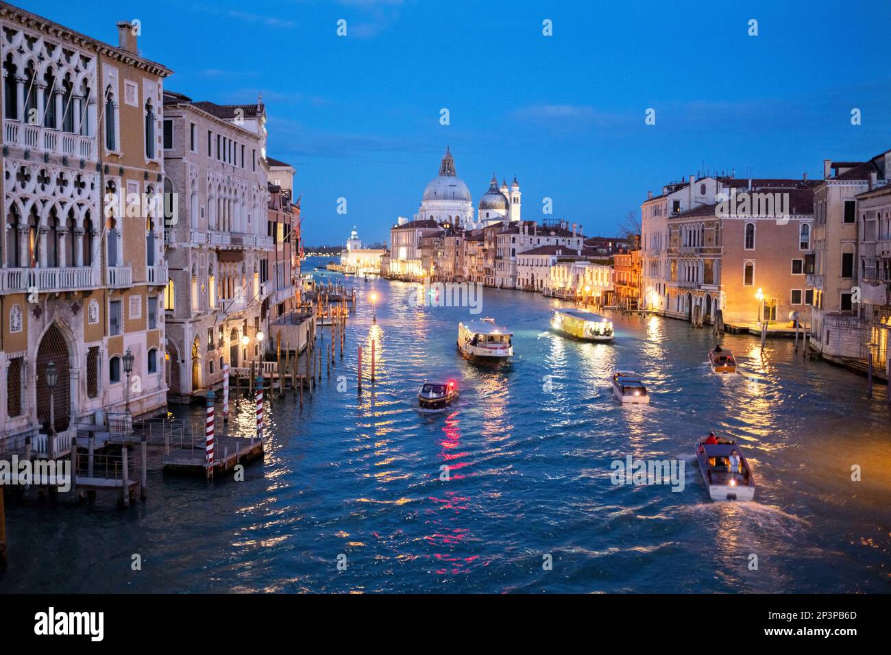 The Grand Canal and Basilica di Santa Maria della Salute after sunset ...