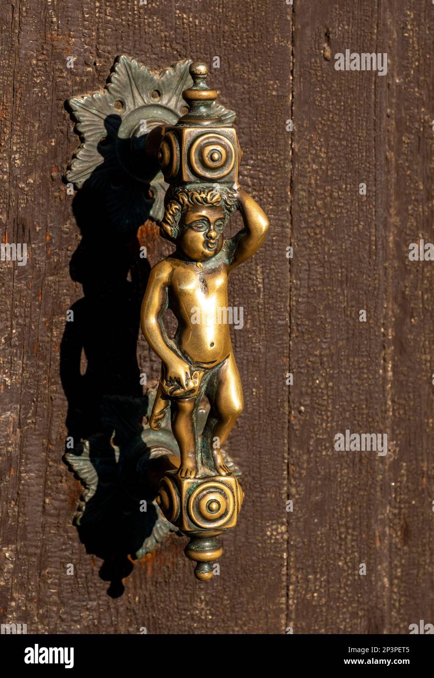 Ornate brass door handle Venice, Italy Stock Photo